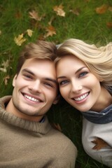 a portrait of a happy young couple lying on the grass