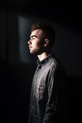 Obraz premium shot of a young man standing alone in the studio