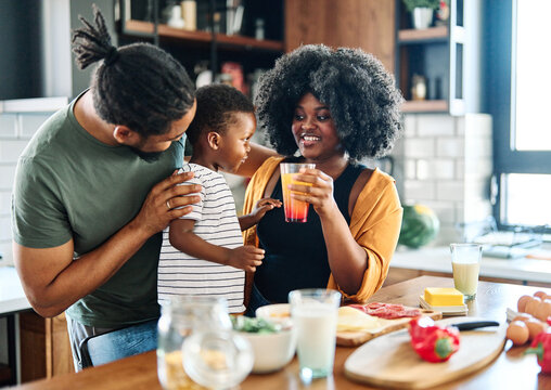 Child Family Kitchen Boy Son Mother Father Drink Breakfast Juice Healthy Fruit Food Drinking Thirsty Eating Glass Home Black African American Childhood Cute Love Bonding