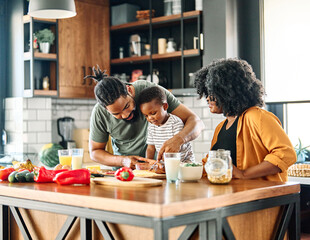 child family kitchen food boy son mother father breakfast preparing egg morning healthy diet eating...