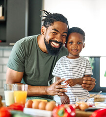 child family kitchen food boy son father breakfast happy together fun morning bonding healthy diet eating home black african american man happy kid game childhood cute parent preparing