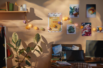 Background image of cozy teens room with wall decor posters and clutter in sunlight, copy space
