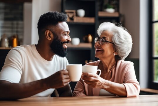 Happy Positive Husband And Grandmother Drinking Black Tea In Game Room, Holding Glasses, Keeping Healthy Hydration, Diet, Lifest . Caring For Family Health, Wellbeing