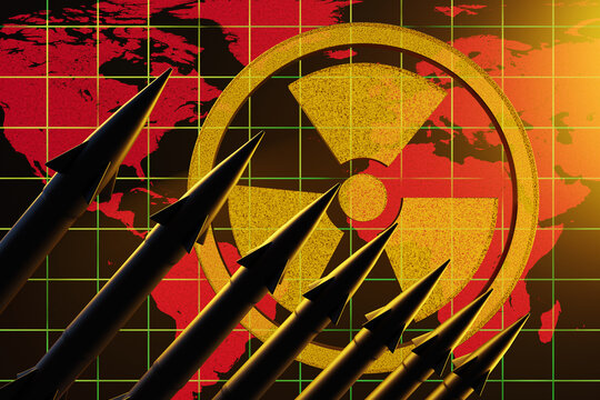 Row of nuclear ballistic missiles in silhouette ready to be launched with the world map and radioactive sign as background. Illustration of the concept of nuclear wars and World War III