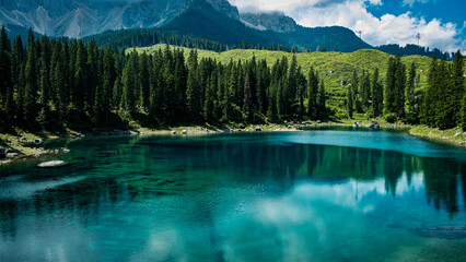 Glimpse of the stupendous Lake Carezza immersed in the Dolomites in Trentino Italy