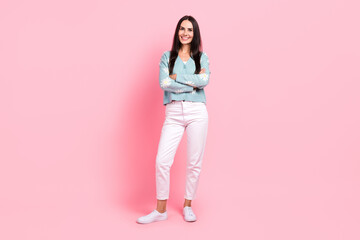 Full length photo of cheerful positive woman dressed blue cardigan smiling arms crossed isolated pink color background