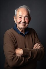 Obraz premium man, elderly and portrait smile with arms crossed on gray studio background