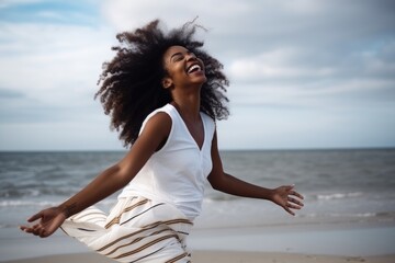 black woman, beach and relax on feet with holiday smile in wind at sea