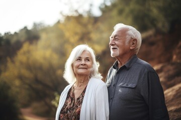 Fototapeta premium shot of a senior couple standing together in nature