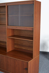 Mid-Century Modern versatile wall unit. Vintage media cabinet with bookshelf. Display furniture. Close-up detail photograph.