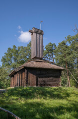 Old wood mill, type holkkvarn, Fr&auml;mmestadskvarnen in a park, a sunny autumn day in Stockholm