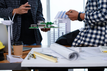 Asian Architect Students Studying Modern House Design and Finding Ways to Utilize Natural Alternative Energy or Use Natural Renewable Energy, Concepts of Eco-Friendly Living for a Sustainable Future.