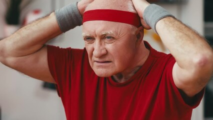 Hilarious grandpa fitness fanatic getting ready for a fight, active lifestyle