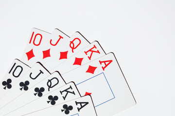 Playing cards on a white background. Top view. Royal flush hand of cards. Playing cards poker casino.
