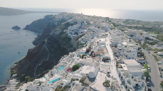 Aerial exploration of Santorini's sunny charm.