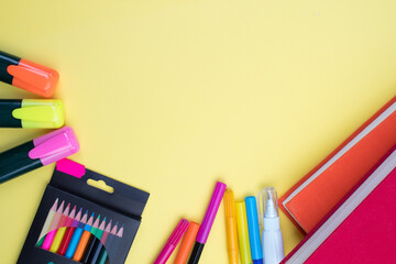 Back to school. Stationery on a yellow table. Office desk with copy space. Flat lay.