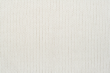 Fototapeta na wymiar Sweater or scarf fabric texture large knitting. Knitted jersey background with a relief pattern. Wool hand- machine, handmade.