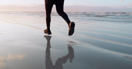 Fitness, sea or legs running on sand in cardio workout or exercise with speed training in Miami. Footwear, fast runner or closeup of sports athlete sprinting or jogging at sunset in nature or beach