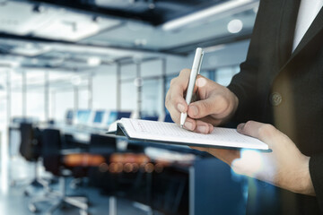 A businessman keeps a journal.