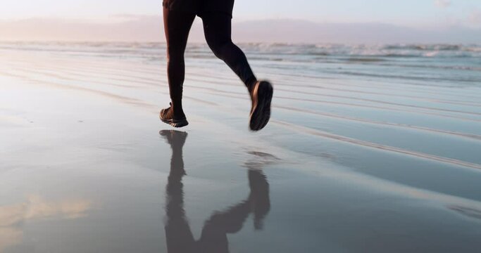 Fitness, sea or legs running on sand in cardio workout or exercise with speed training in Miami. Footwear, fast runner or closeup of sports athlete sprinting or jogging at sunset in nature or beach