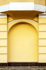 Part of an old house with yellow arches.Background image.