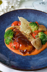 Grilled Chicken Fillet with Vegetables and Sauce, Roasted Chicken Breast on a Plate on Bright Background