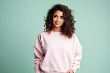 Fototapeta premium Portrait of a Fictional Model Wearing a Large Oversized Plain Sweatshirt Isolated on a Colored Blank Background. Generative AI.