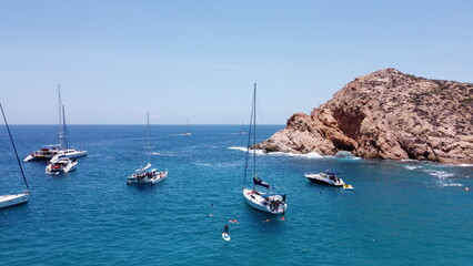 photography with drone of yachts in santa maria beach cabo san lucas california mexico