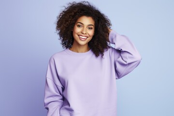 Fototapeta premium Portrait of a Fictional Model Wearing a Large Oversized Plain Sweatshirt Isolated on a Colored Blank Background. Generative AI.