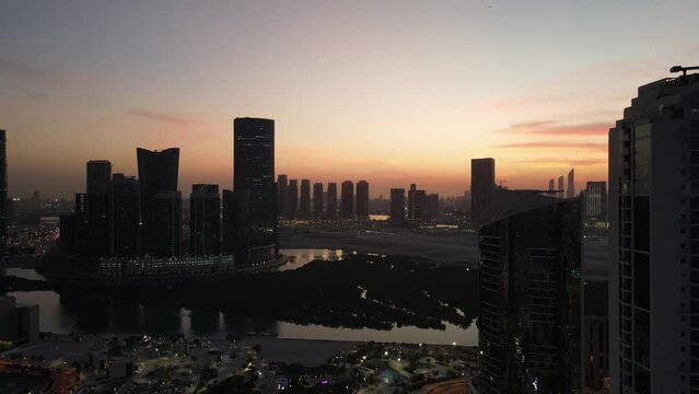 Modern silhouettes of high rise towers in Al Reem island in Abu Dhabi, aerial view