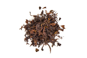 Dry black tea leaves, isolated on white background.