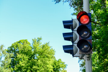 View of red traffic light in city, closeup