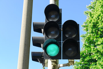 View of green traffic light in city, closeup