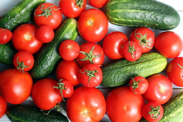 Background from fresh cucumbers and tomato.