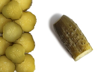 Salted tasty cucumbers lie on a white isolated background.