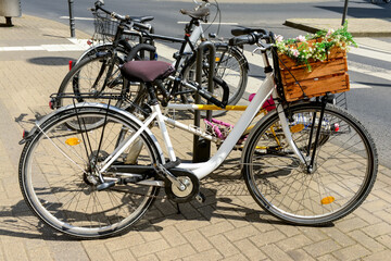 Fototapeta na wymiar Modern bicycles parked on city street