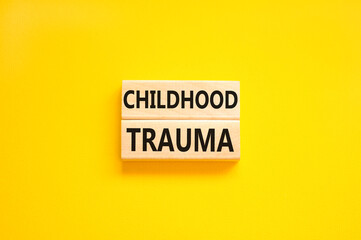 Childhood trauma symbol. Concept words Childhood trauma on beautiful wooden blocks. Beautiful...