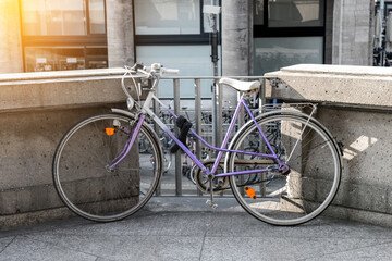 Fototapeta na wymiar Modern bicycle parked on city street