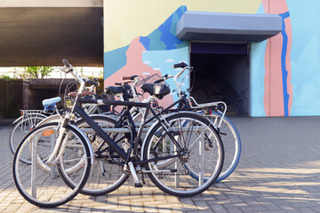 Fototapeta na wymiar Modern bicycles parked on city street