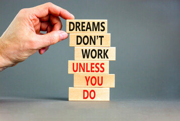 Dream and do symbol. Wooden blocks with words Dreams do not work unless you do. Beautiful grey...