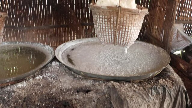 Boiling rock salt, traditional salt making of Bo Kluea rock salt pond, Nan Province, Thailand
