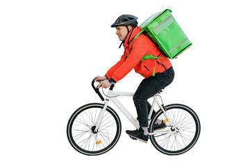 The deliveryman is a confident person riding a bike. A cyclist courier is a man in a helmet and a thermo bag riding a bicycle to work. Stylish convenient eco transport in the city. - obrazy, fototapety, plakaty