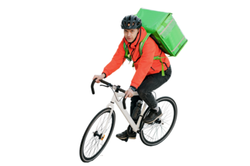 Cyclist courier a man in a helmet rides a bicycle to work. Stylish convenient eco transport in the city. The deliveryman is a confident person riding a bike.