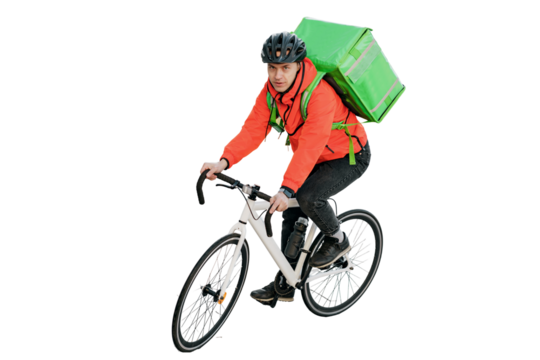 Cyclist courier a man in a helmet rides a bicycle to work. Stylish convenient eco transport in the city. The deliveryman is a confident person riding a bike.