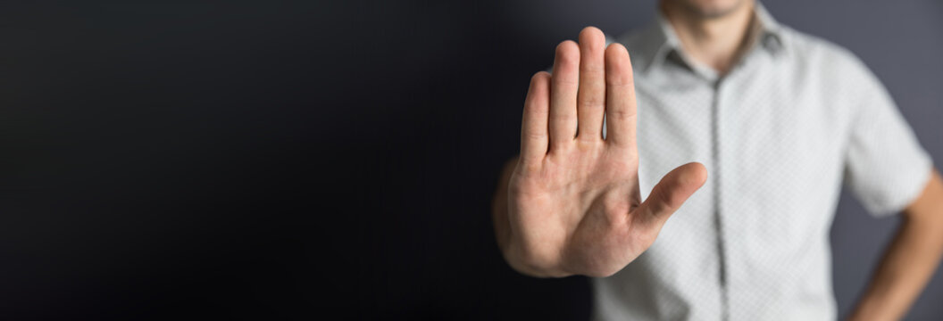 man hand stop sign