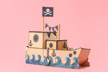 Pirate cardboard ship on pink background