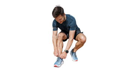 A runner has a healthy lifestyle, sportswear and sneakers. A trainer performing fitness exercises.   Athletic man training jogging full-length.