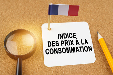 On the table is the flag of France and a sheet of paper with the inscription - consumer price index