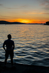 man admiring the sunset