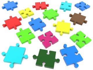 Puzzle pieces of different colors scattered on white